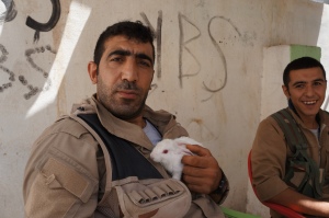 A PKK fighter with his pet rabbit